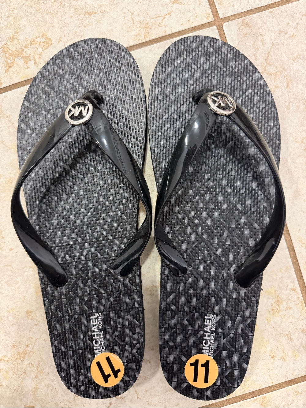 NEW  women “Michael Kors Black Flip Flop Sandals with silver accent( Size 11" )